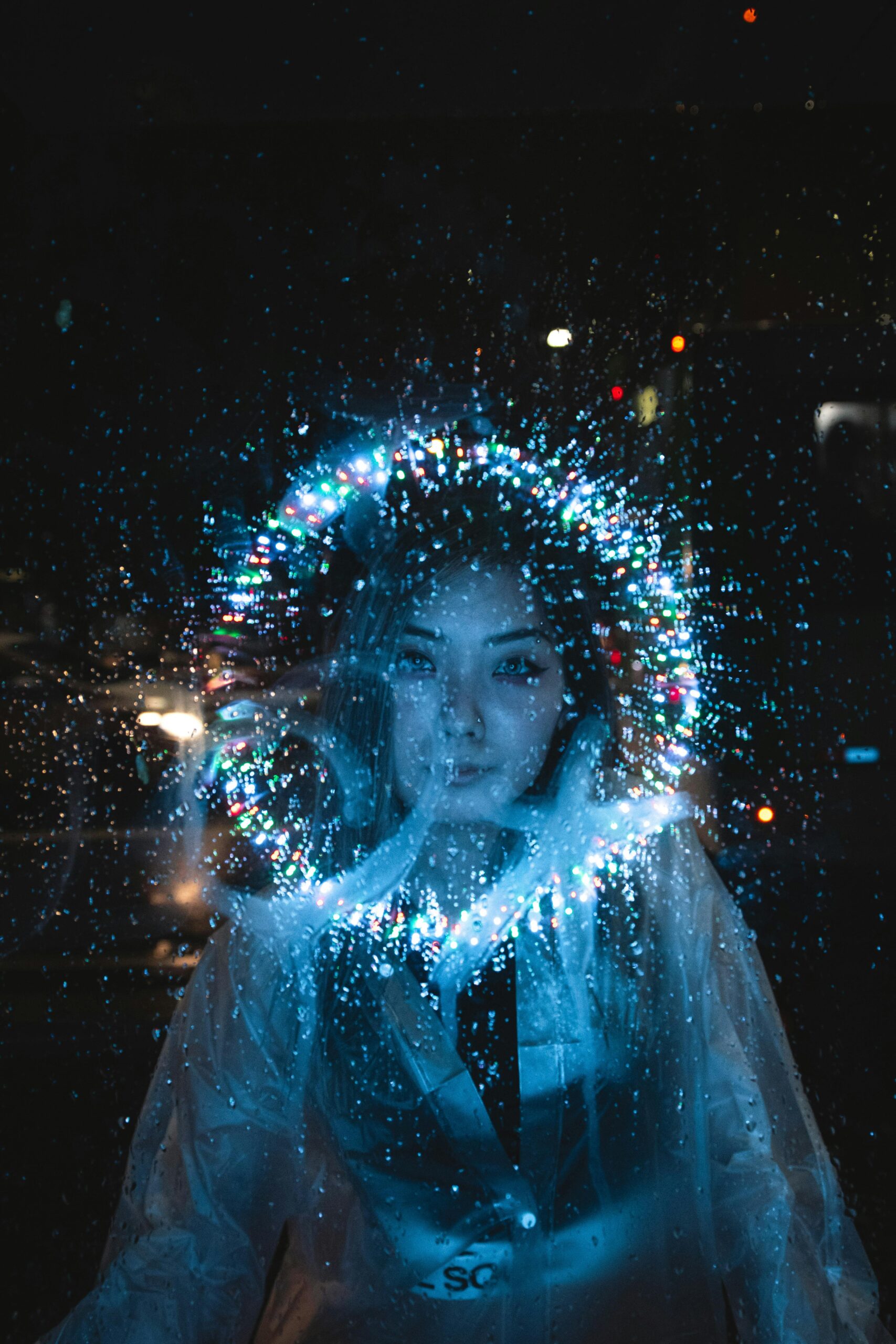 A captivating night portrait of a woman with vibrant fantasy light effects.